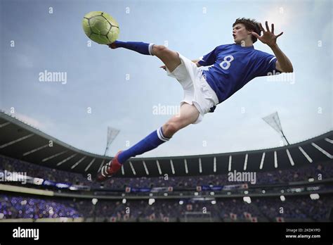 Soccer Player Hitting The Ball Stock Photo Alamy