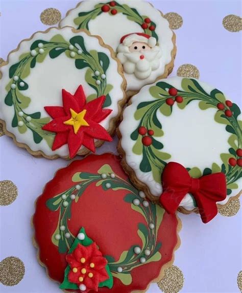 Three Decorated Cookies Sitting On Top Of A Table