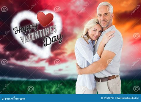 Composite Image Of Happy Couple Standing And Smiling At Camera Stock