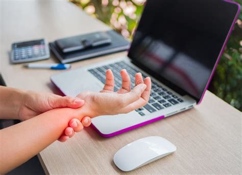 Closeup Woman Holding Her Wrist Pain From Using Computer Stock Image