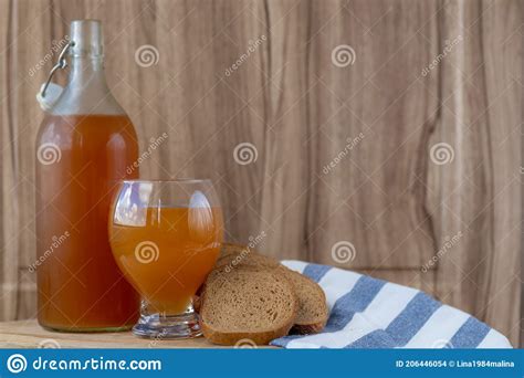 Traditional Russian Cold Rye Drink Kvass In A Glass And A Jug On A