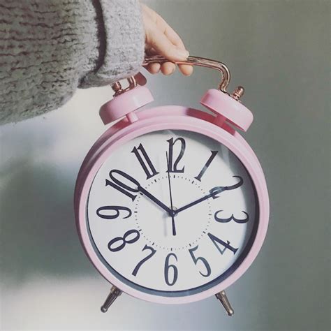 Premium Photo Cropped Hand Holding Alarm Clock