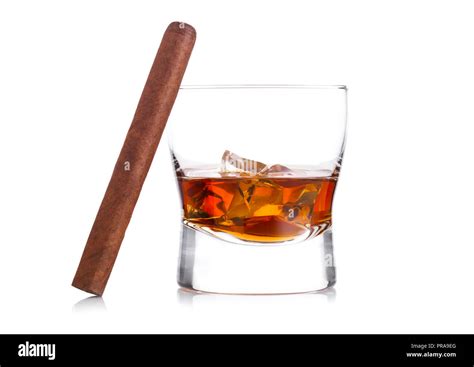 Glass Of Whiskey With Ice Cubes And Cigar On White Background Cognac