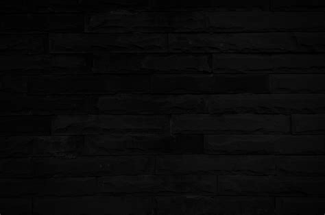 Old Black Brick Wall Texture For Background With Copy Space For Design