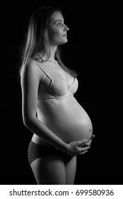 Naked Pregnant Woman On Black Background Stock Photo 140491903 Shutterstock