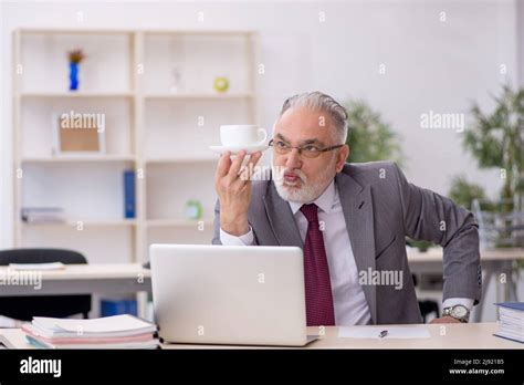 Old Employee Drinking Coffee During Break Stock Photo Alamy