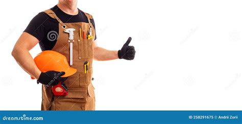 Contractor Worker Or Carpenter In Apron With Tools And Helmet Holding