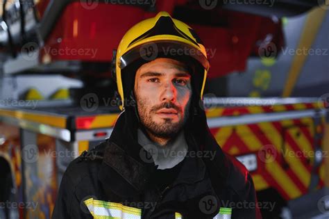 Photo Of Fireman With Gas Mask And Helmet Near Fire Engine 43271136