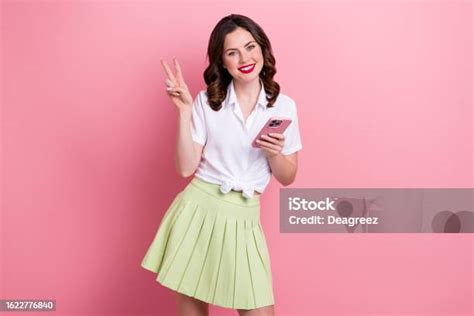 Photo Of Funky Cheerful Young Lady Wear White Shirt Showing Vsign