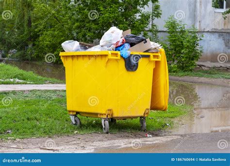 Trash Cans Are Full Yellow Trash Bin Plastic Trash Can Stock Photo