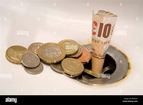 Money Down Drain Stock Photos & Money Down Drain Stock Images - Alamy