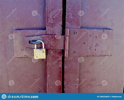 Old Padlock On A Wooden Door Wooden Door Locked With Padlock Close Up