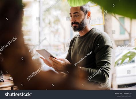 Smiling Mature Man Using Tablet Pc Stock Photo Shutterstock