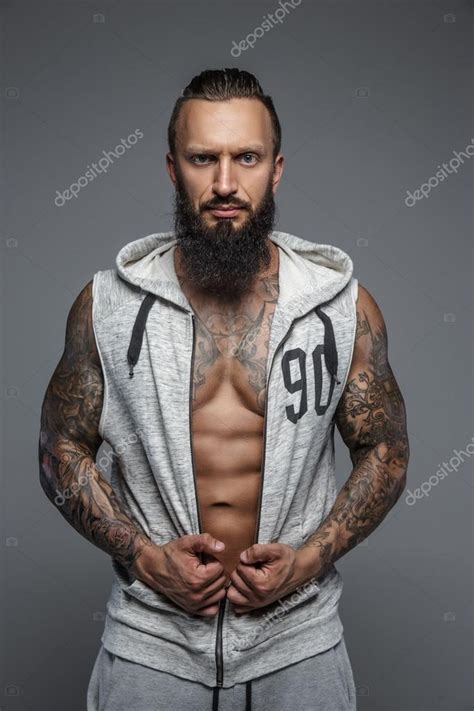 Muscular Tattooed Man With Beard Stock Photo By Fxquadro 86693432