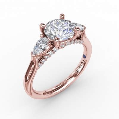 Classic Three Stone Diamond Engagement Ring With Pear Shape Side Diamonds