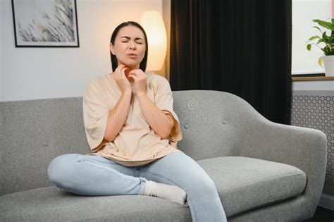 Attractive Brunette Sitting On Bed With Sore Throat Stock Image Image Of Hand People