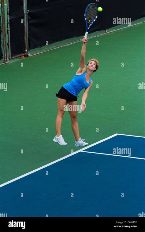 Tennis Star Maryna Kozachenko Up In The Air Swinging Racquet Before