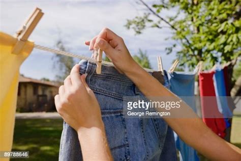 Woman Hanging Laundry On Clothes Line Photo Getty Images