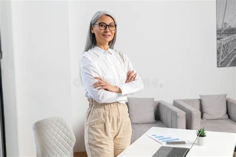 Portrait Of A Senior Mature Gray Haired Female Professional Leader