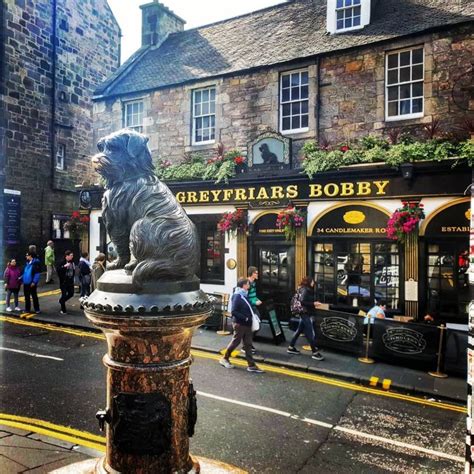 Greyfriars Bobby bronze statue and pub, Edinburgh, Scotland. Bobby was ...