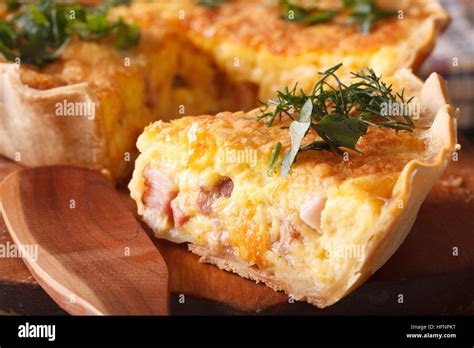 A Piece Of French Quiche Lorraine On The Cutting Board Macro