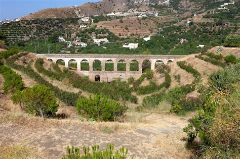 Premium Photo | Front view of the historic roman aqueduct in the city ...