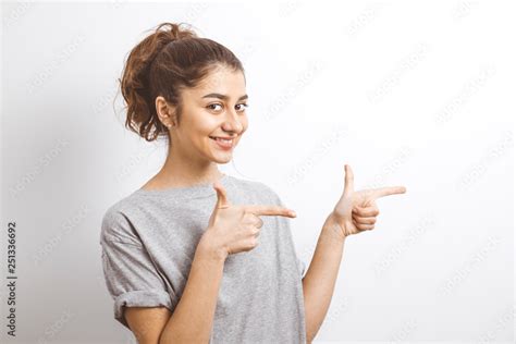 Happy Indian Girl Pointing Finger At The Blank Copy Space Stock Photo