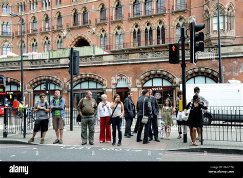 Pedestrians Crossing Euston Road In Front Of St Pancras Station