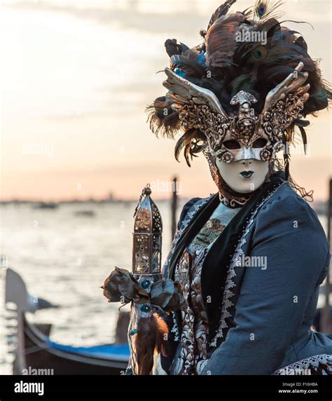 An Ornate Headdress With Winged Mask And Peacock Feathers At The Venice