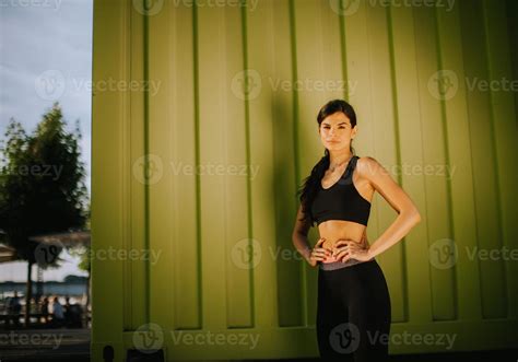 Pretty Young Woman Taking A Break During Exercising Outside 13353877