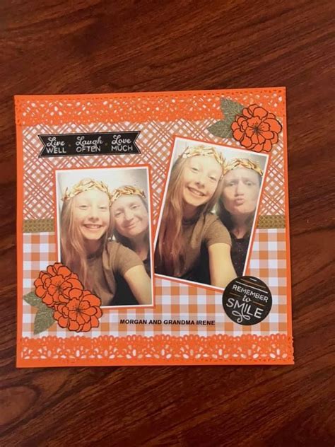 An Orange And White Card With Two Girls In The Middle One Is Wearing A