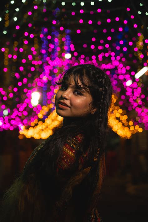 Woman With Black Hair Holding Paper Cup At Night · Free Stock Photo