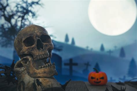 Spooky cemetery with glow halloween pumpkin 10621931 Stock Photo at Vecteezy