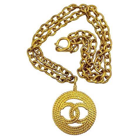 Vintage Chanel Logo Necklace at 1stDibs