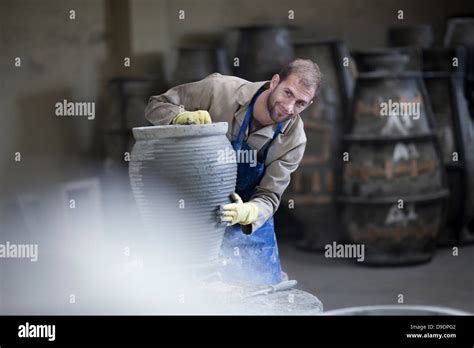 Sculpting and shaping pottery Stock Photo - Alamy