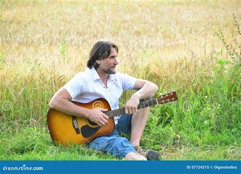 Man With A Guitar In A Field Stock Image Image Of Strings Grass