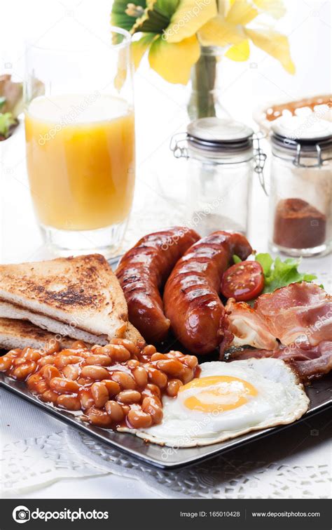 Full English Breakfast With Bacon Sausage Egg Baked Beans And Orange