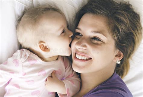 Happy Mother With Baby Lying On Bed At Home Stock Image Image Of