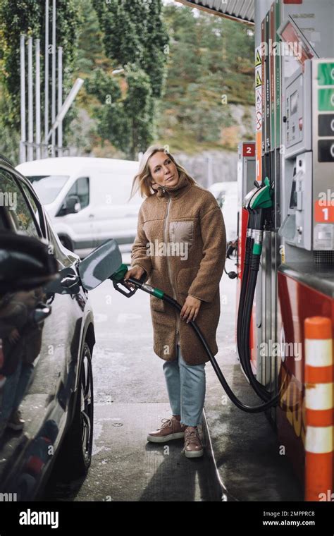 Mature Woman Refueling Car At Gas Station Stock Photo Alamy