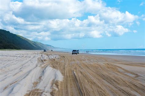 4wd Vehicles at Rainbow Beach with Coloured Sand Dunes, QLD, Australia ...