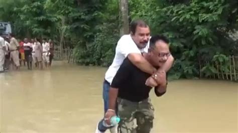 Assam Bjp Mla Takes Piggyback Ride To Boat In Flood Hit Hojai Watch