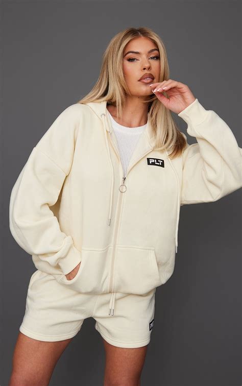 Plt Cream Badge Oversized Zip Up Hoodie Prettylittlething Usa