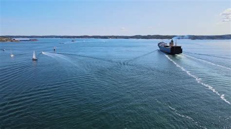 General Cargo Ship Sailing At Skagerrak Strait Passing By Sailboats ...