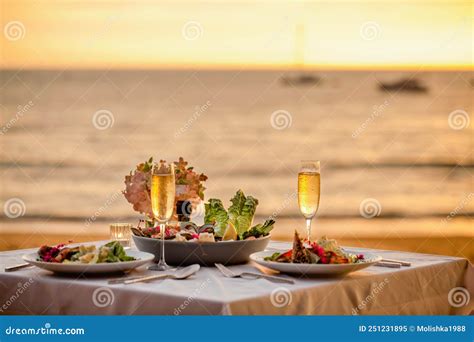 Romantic Sunset Dinner On Beach Table Honeymoon Set For Two With Luxurious Food Glasses Of