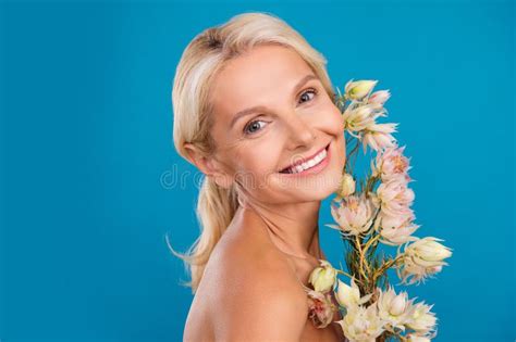 Photo Of Dreamy Pretty Senior Woman Nude Shoulders Smiling Flowers