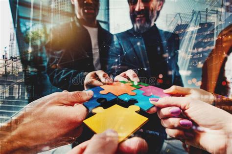 Teamwork Of Partners Connect Puzzle Pieces As Integration And Startup