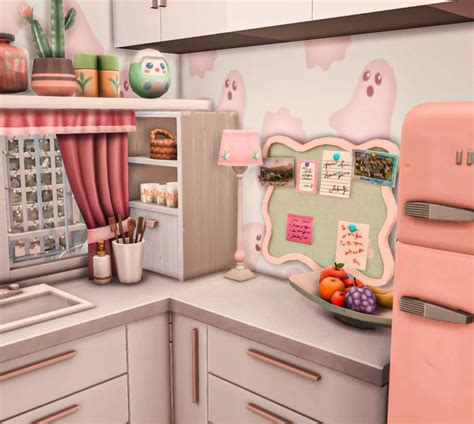 A Pink Refrigerator Freezer Sitting Inside Of A Kitchen