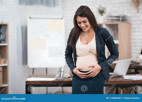 Young Pregnant Girl Is Experiencing Labor In Office Pregnant In Office