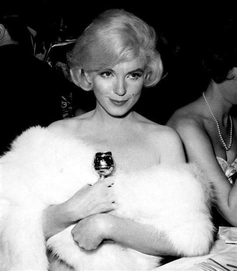 Marilyn Monroe With The Golden Globe She Won For Some Like It Hot