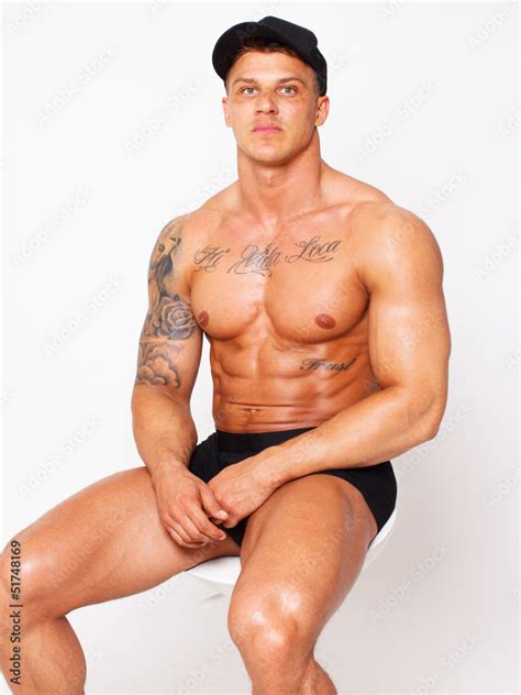 Shy Shirtless Bodybuilder Is Sitting On The Chair Stock Photo Adobe Stock